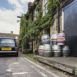 Austin Mini beside Cotswolds Pub, Burford, England